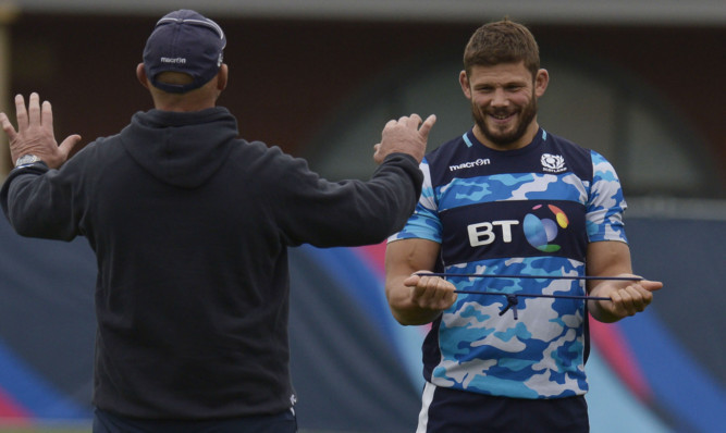 Ross Ford and head coach Vern Cotter have a lighter moment at yesterday's final training session.