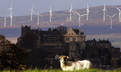 Stirling Castle, with the Braes of Doune wind farm in the background.