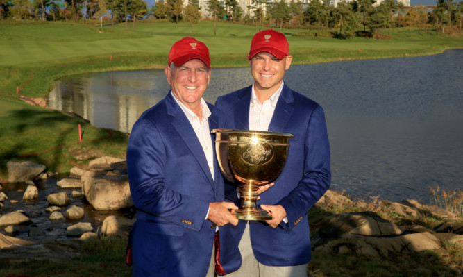 Team USA captain Jay Haas and son Bill Haas with the Presidents Cup.