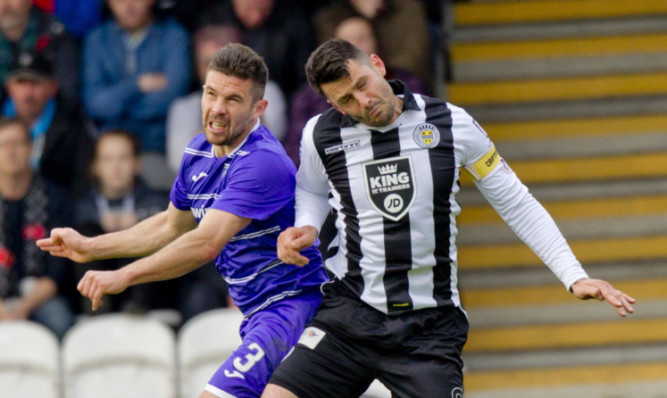 Jason Talbot in an aerial challenge with Steven Thomson of St Mirren.