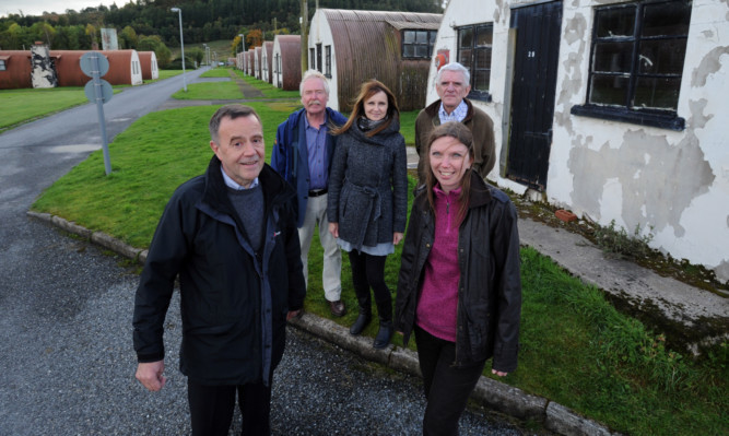 Front: Comrie Development Trust chairman Bill Thow with land reform minister Dr Aileen McLeod and, back, from left, treasurer Bob Hughes, Fiona Davidson of the heritage group and board member Lt Col William Levack at Cultybraggan Camp.
