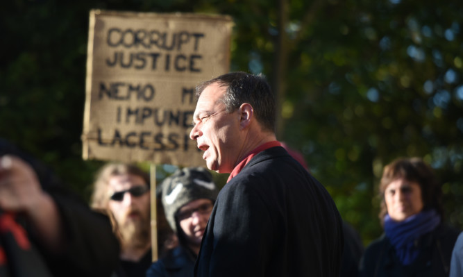 Tony Cox at a demonstration outside the Forfar Sherrif Court.