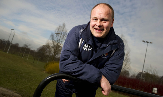 03/03/11 
GARSCUBE - GLASGOW
All smiles from Kilmarnock manager Mixu Paatelainen as he looks ahead to his side's weekend SPL clash with Hearts