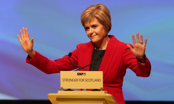 Nicola Sturgeon takes the acclaim at her first party conference as SNP leader.