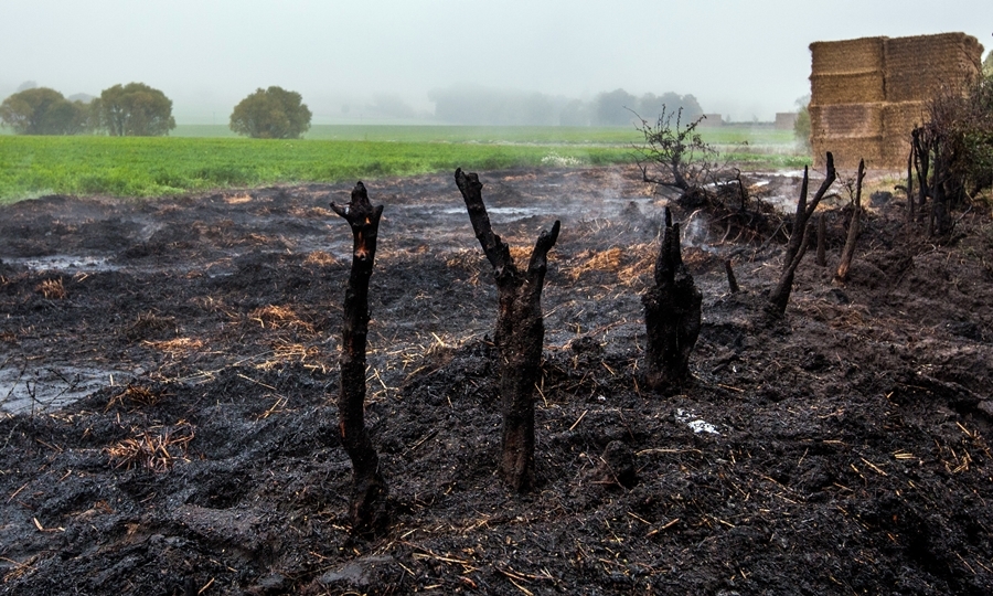 Steve MacDougall, Courier, A984 East of Caputh. Road closed due to hay bale fire in field. Pictured, the smoking remains.