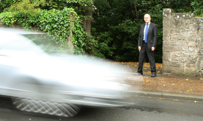 Councillor Willie Wilson at the point where the path meets Glasgow Road.