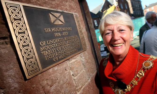 Provost Helen Oswald for unveils the tribute to Sir Hugh Munro at the Gateway to the Glens Museum.