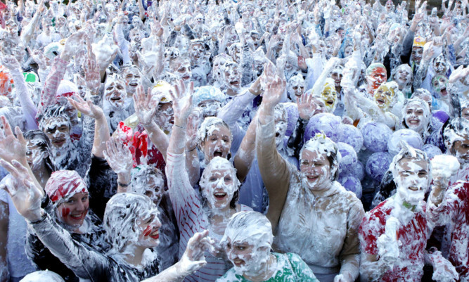 Students at St Andrews University taking part in the annual foam party on "Raisin Monday".