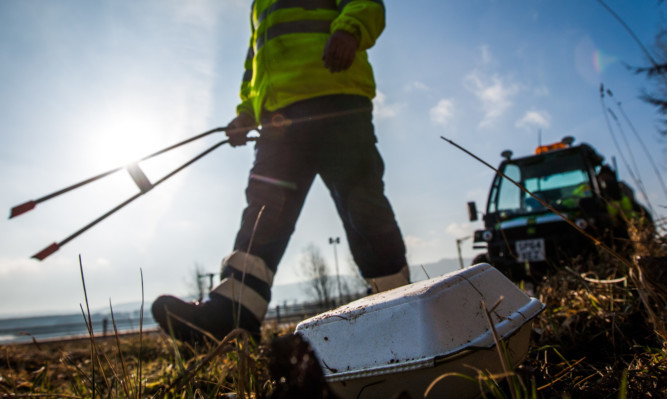 Litter pickers work on the A9.