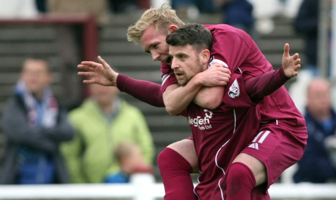 Bobby Linn celebrates his opening goal with Darren Ramsey.