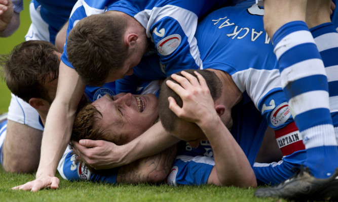 St Johnstone's Liam Craig celebrates his opener amongst team mates.