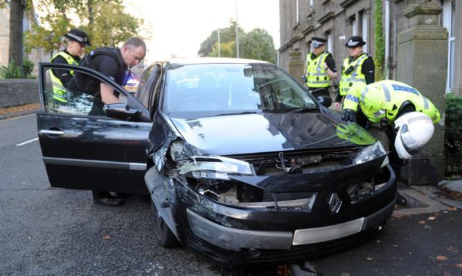 Police inspecting the car.