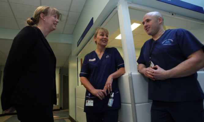 Dundee MSP and Health Minister Shona Robison at Ninewells Hospital with consultant Andrew Reddick and specialist charge nurse Moira Raitt.