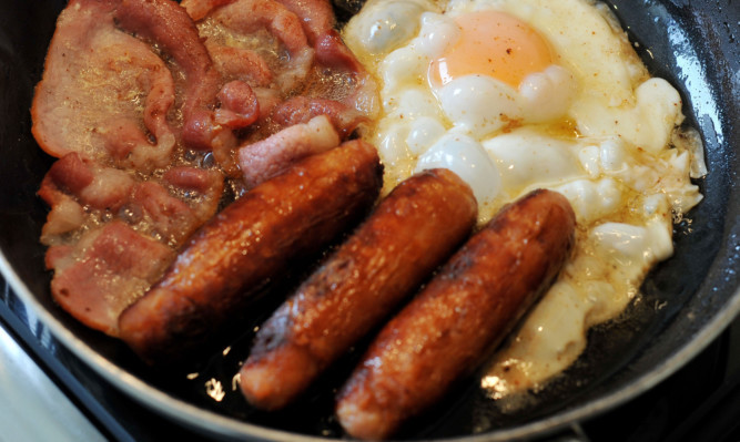 Egg, sausages and bacon being fried in a frying pan.
PRESS ASSOCIATION Photo. Picture date: Wednesday August 27, 2014. Photo credit should read: Nick Ansell/PA Wire