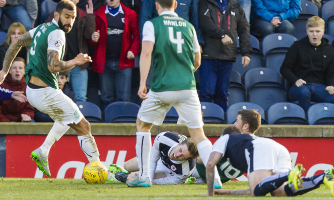 Craig Wighton (below centre) grimaces in pain after a challenge from Lewis Stevenson.