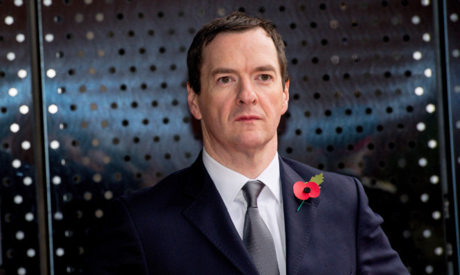 MANCHESTER, ENGLAND - OCTOBER 23:  Chancellor of the Exchequer George Osborne waits for The President of the People's Republic of China Xi Jinping to arrive to tour the National Graphene Institute at Manchester University with the Chancellor of the Exchequer George Osborne on October 23, 2015 in Manchester, England. After listening to a presentation from Dame Nancy Rothwell, the party toured the University Centre which leads the world in graphene research and is one of the most important centres for commercialising the one-atom-thick material. (Photo by Richard Stonehouse - WPA Pool/Getty Images)