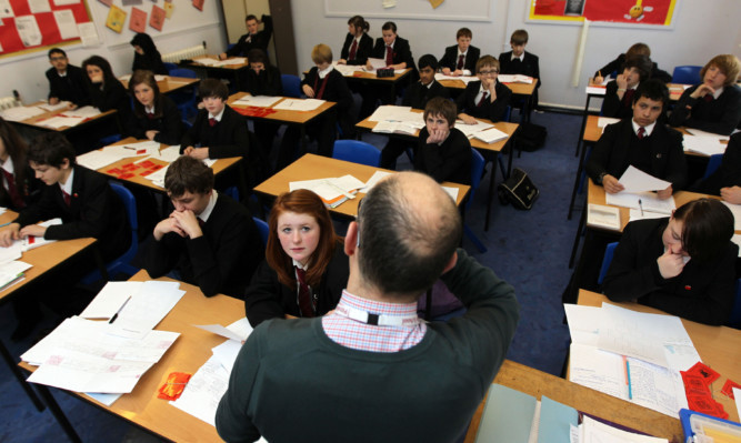 Teacher during a History lesson at Pittville High School, Cheltenham
February 8 2012.
PA Photo : David Davies.