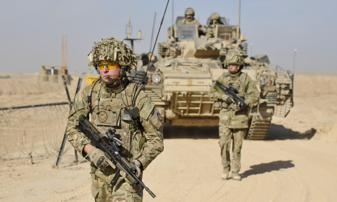 Britain is to maintain its military support mission in Afghanistan until the end of next year, Defence Secretary Michael Fallon has announced.