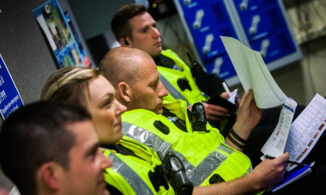 A briefing at Downfield Police Station.