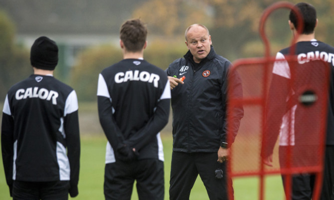 Dundee Utd manager Mixu Paatelainen gets his point across at training.