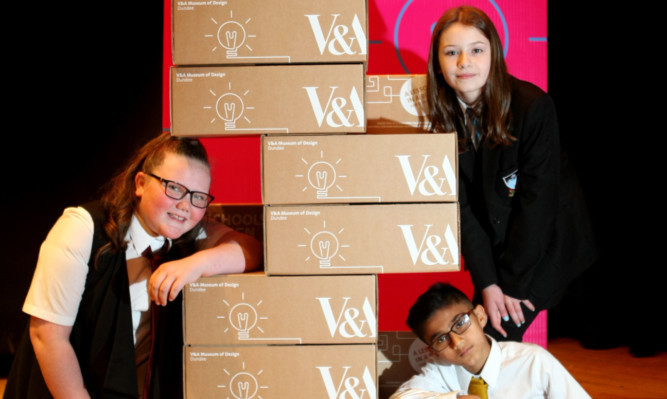 Pupils Rachel Glen, Lucy Bertie and Uwais Din with some of the packs.