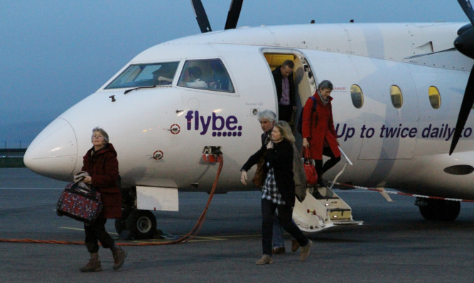 Passengers disembarking from the flight from Stansted to Dundee Airport.