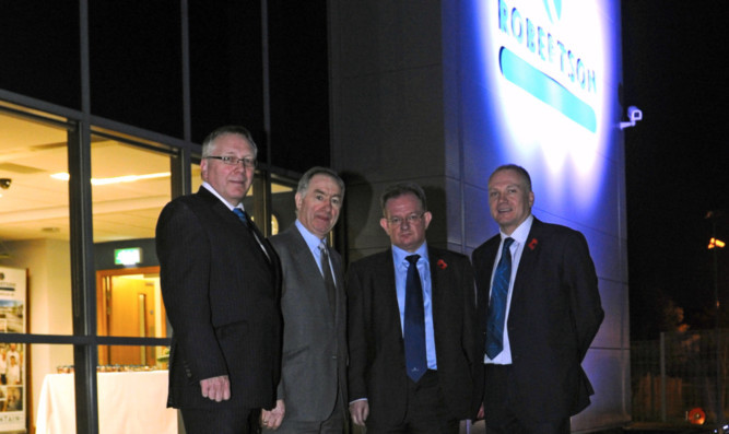 At the official opening of the new office are, from left, Ian Gibson, managing director of Robertson Facilities Management, executive chairman Bill Robertson, Kevin Dickson, Robertson Tayside regional managing director, and Derek Shewan, Robertson Group chief operations officer.