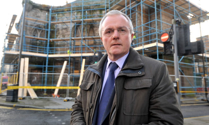 Councillor Peter Barrett says the scaffolding at St Pauls is well overdue.