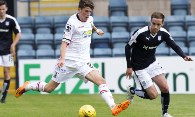 Nick Ross (right) closes down Caley Thistle's Ryan Christie.