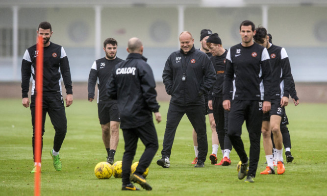 Mixu Paatelainen sees reason to smile during training this week.