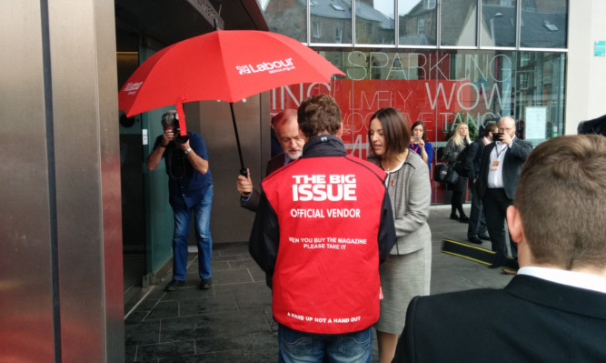 Jeremy Corbyn stopped in front of the cameras and party faithful to buy a copy of the Big Issue from a vendor - who had no clue who he was.