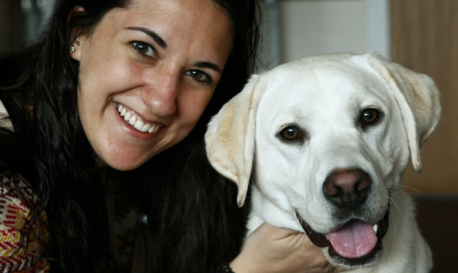 Student Emma Solanki with one of the guide dogs, Verney.