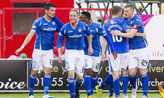 Graham Cummins (left) celebrates his second goal of the game.