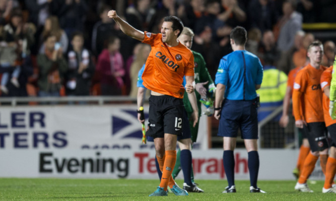 United defender Ryan McGowan greets the full-time whistle.