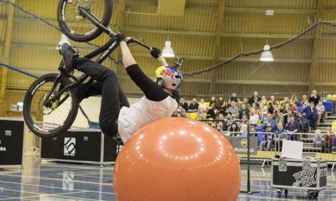 Stunt cyclist Danny MacAskill shows off his skills.
