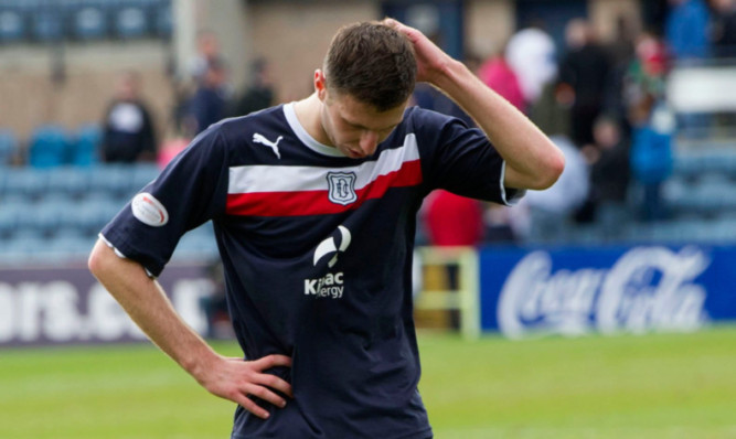 Despair at full-time on Sunday for Lewis Toshney.