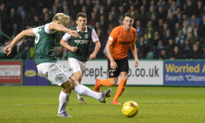 Jason Cummings doubles the lead for Hibs from the penalty spot.