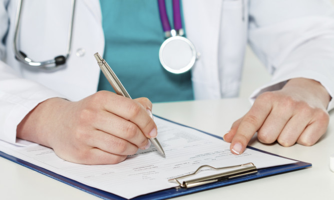 Female medicine doctors hands filling patient medical form. Physician working with paper in hospital office room. Therapeutist sitting at working table making some paperwork. Hands holding silver pen