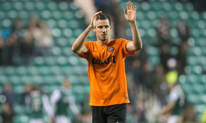 Ryan McGowan applauds the United support at Easter Road.