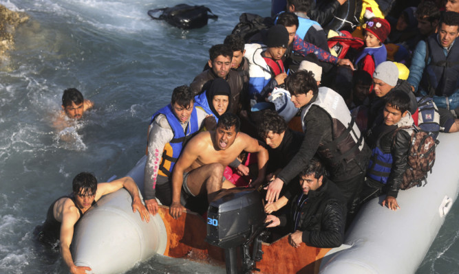 Refugees and migrants trying to reach the Greek island of Chios at the weekend.