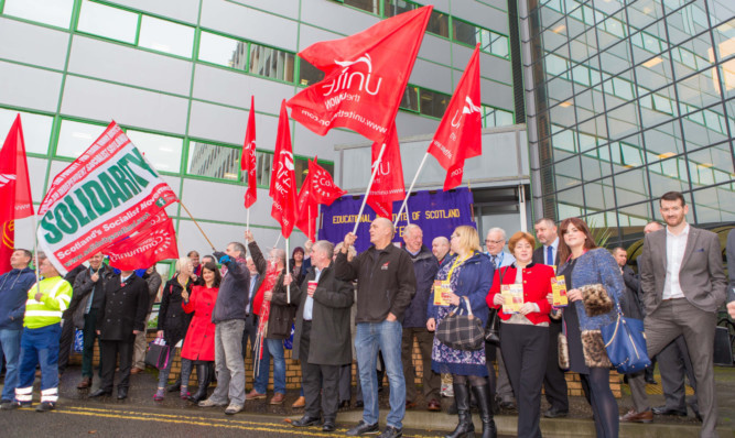 Protesters opposing the UK Governments Trade Union Bill outside the council meeting.