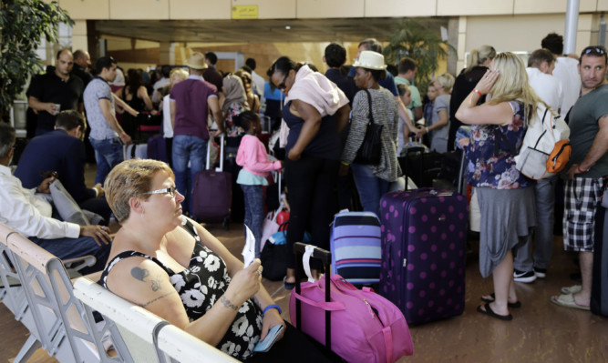 British tourists wait at the airport in Sharm el-Sheikh.