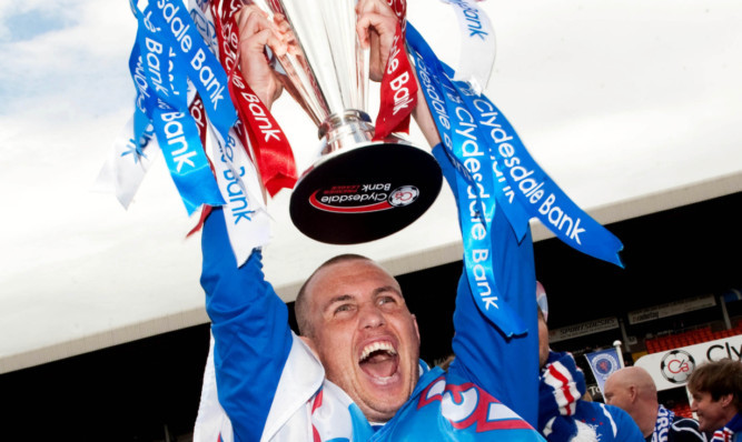 Rangers Kenny Miller with the SPL trophy in 2009  but should the club keep the titles won in that period?