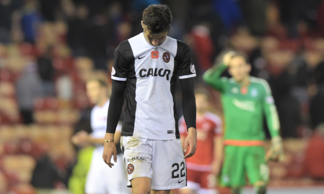 Dundee United's Scott Fraser trudges off the pitch.