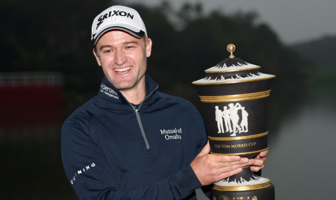 Russell Knox with the winner's trophy.