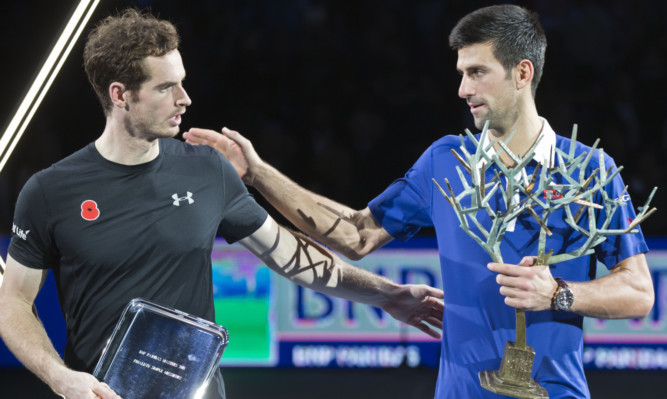 Andy Murray and Novak Djokovic leave the podium after the final of the BNP Masters.