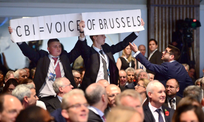 The protesters heckled the Prime Minister as he gave a speech at the  CBI conference in London.