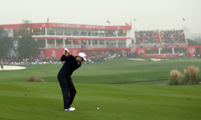 Russell Knox plays his second shot to 18 in the final round of the HSBC Champions in Shanghai.