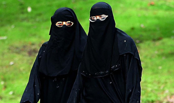 Muslim women out doing their shopping in Blackburn wearing the Niqab.