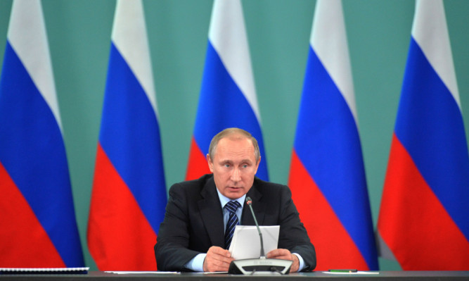 Russian President Vladimir Putin speaks during his late-night meeting with the heads of Russia's sports federations.